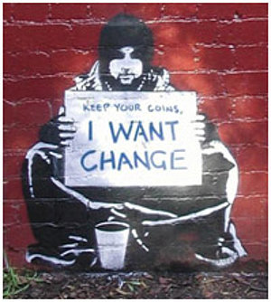 Graffiti Bild eines am Boden sitzenden Mannes mit dem Schild: "Keep your coins. I want change"